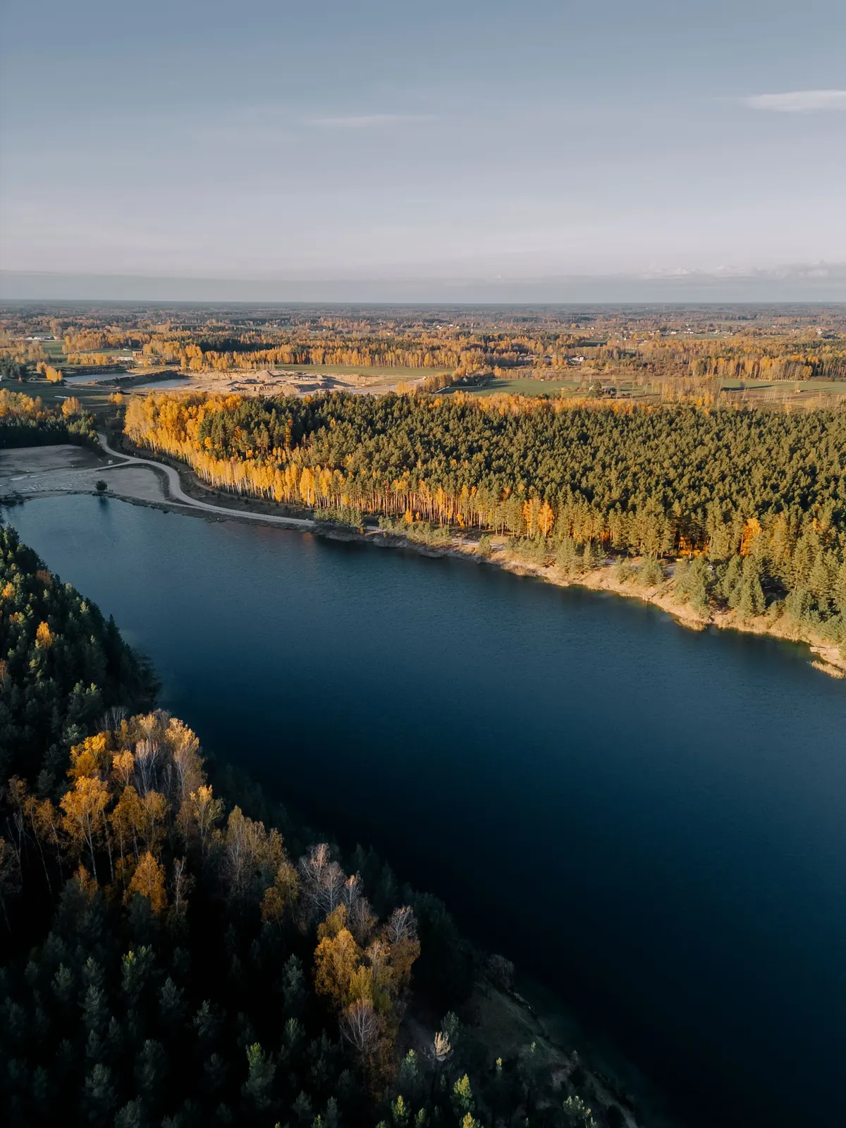 A river winding through autumn forest from above (sample image)