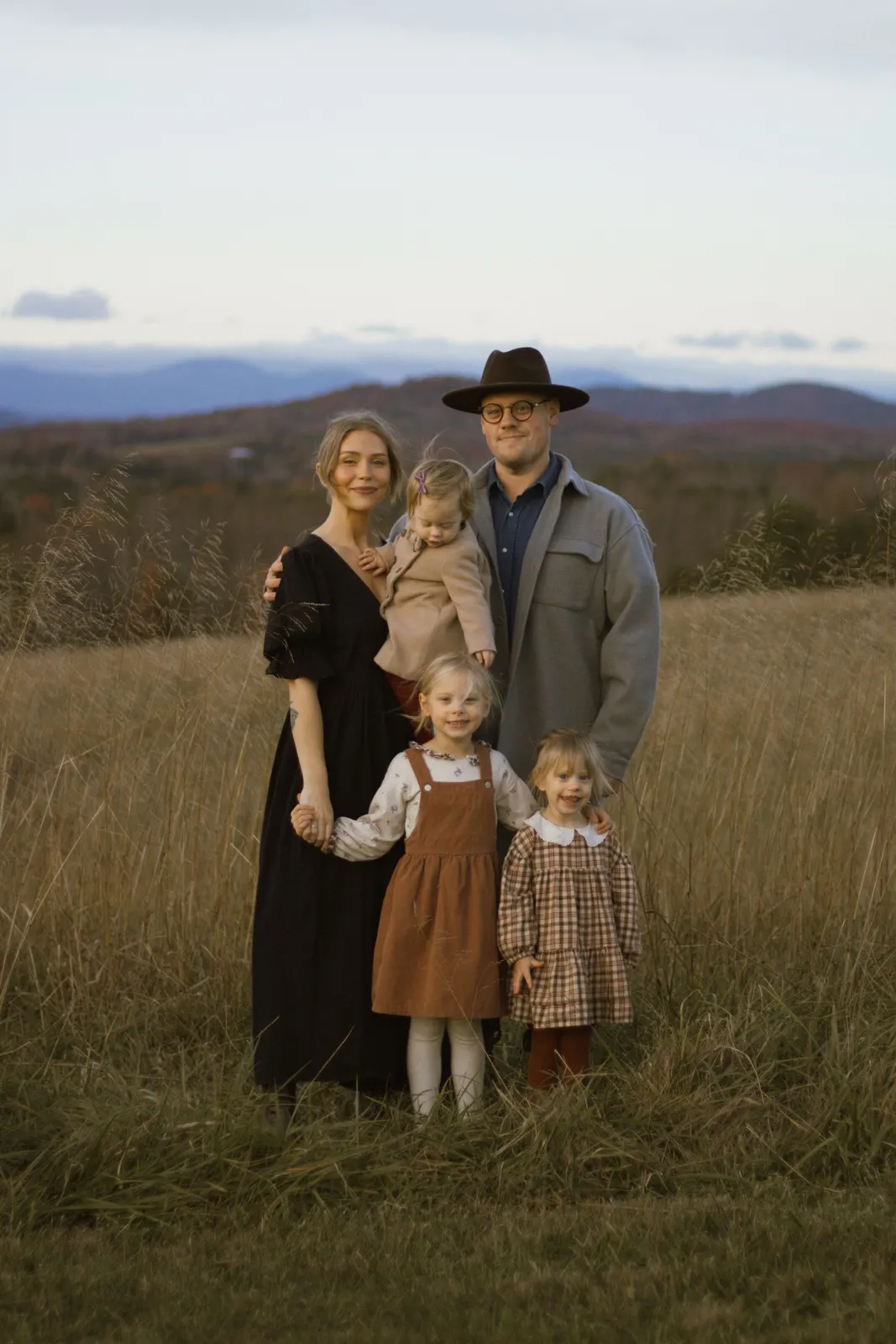 Family of five standing in a meadow (sample image)